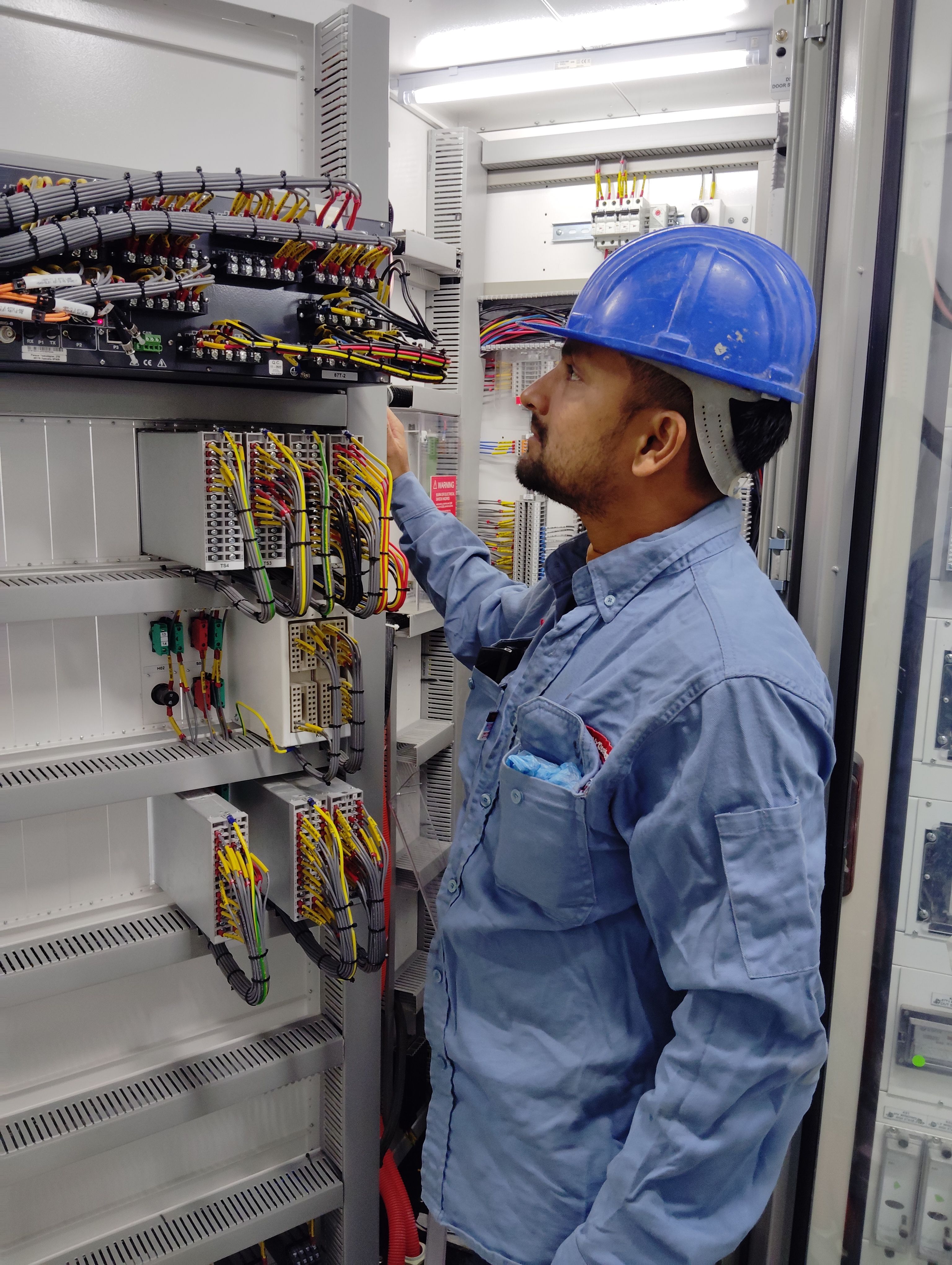 Electrician repairing electrical wiring and components